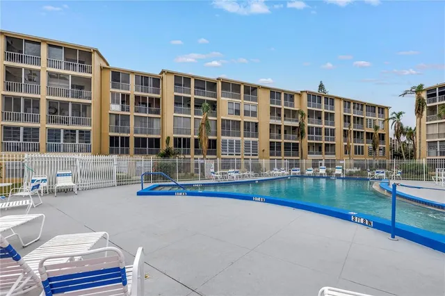 a view of pool with outdoor seating