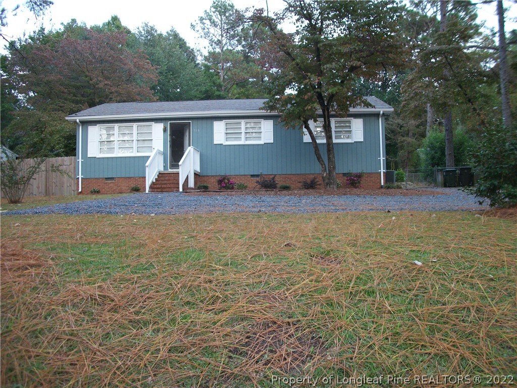 718 North Chapin Road Aberdeen, NC 28315 - Photo 2 of 17 a view of a house with a yard and sitting area