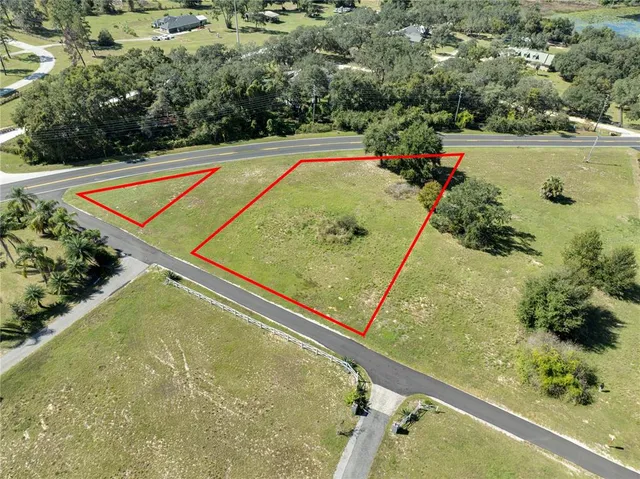 a view of a pool and a yard
