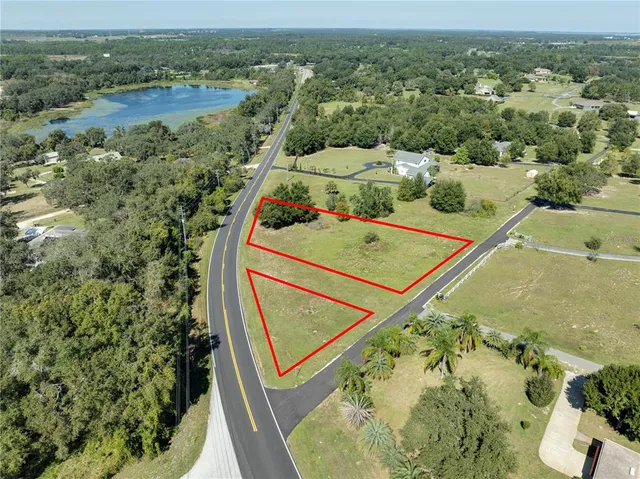an aerial view of a residential houses with outdoor space