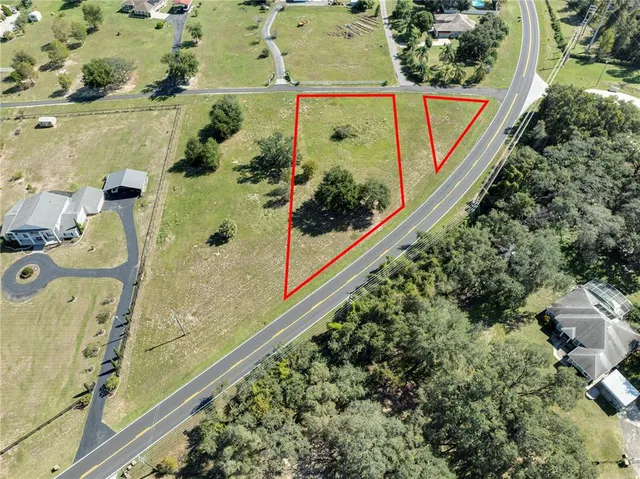 an aerial view of residential house with outdoor space