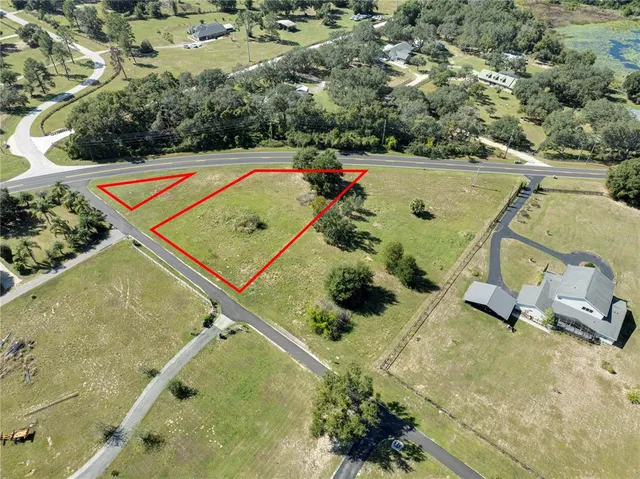 a view of a lake with a yard