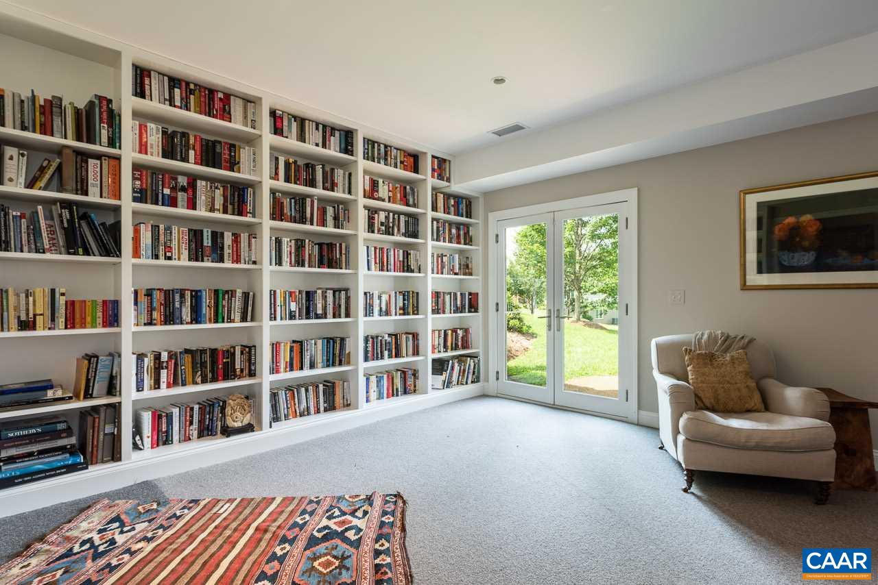 3520 Rocks Mill Lane Charlottesville, VA 22903 - Photo 38 of 50 a living room with furniture and a book shelf