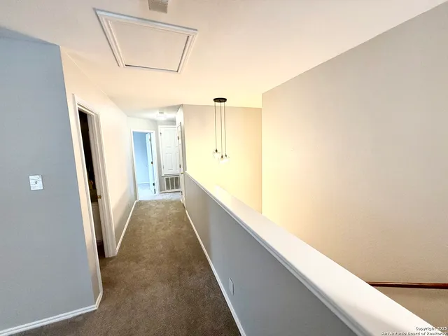 a view of hallway with stairs