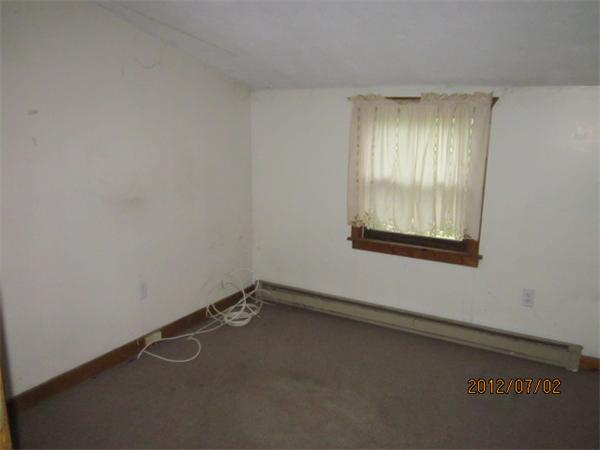 14 Davis Road Holland, MA 01521 - Photo 2 of 7 an empty room with a window