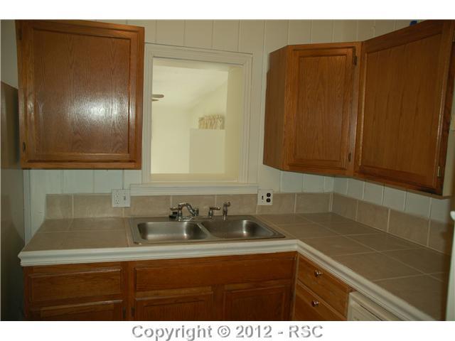110 West Cheyenne Road Colorado Springs, CO 80906 - Photo 15 of 25 Kitchen in the cottage, guest house, in law suite, separate entry home office or art studio.
