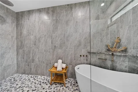 a bathroom with a bathtub and a toilet