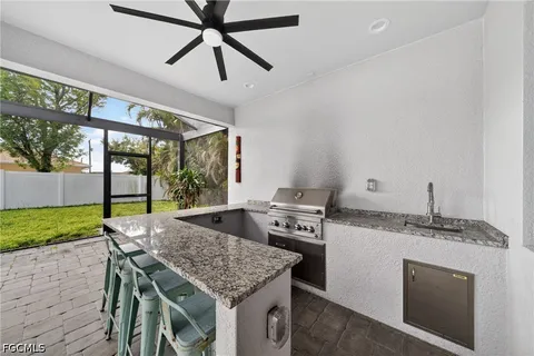 a kitchen with a table chairs and wooden floor