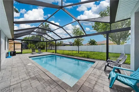 a view of swimming pool with a patio