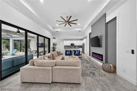 a living room with fireplace furniture and a flat screen tv