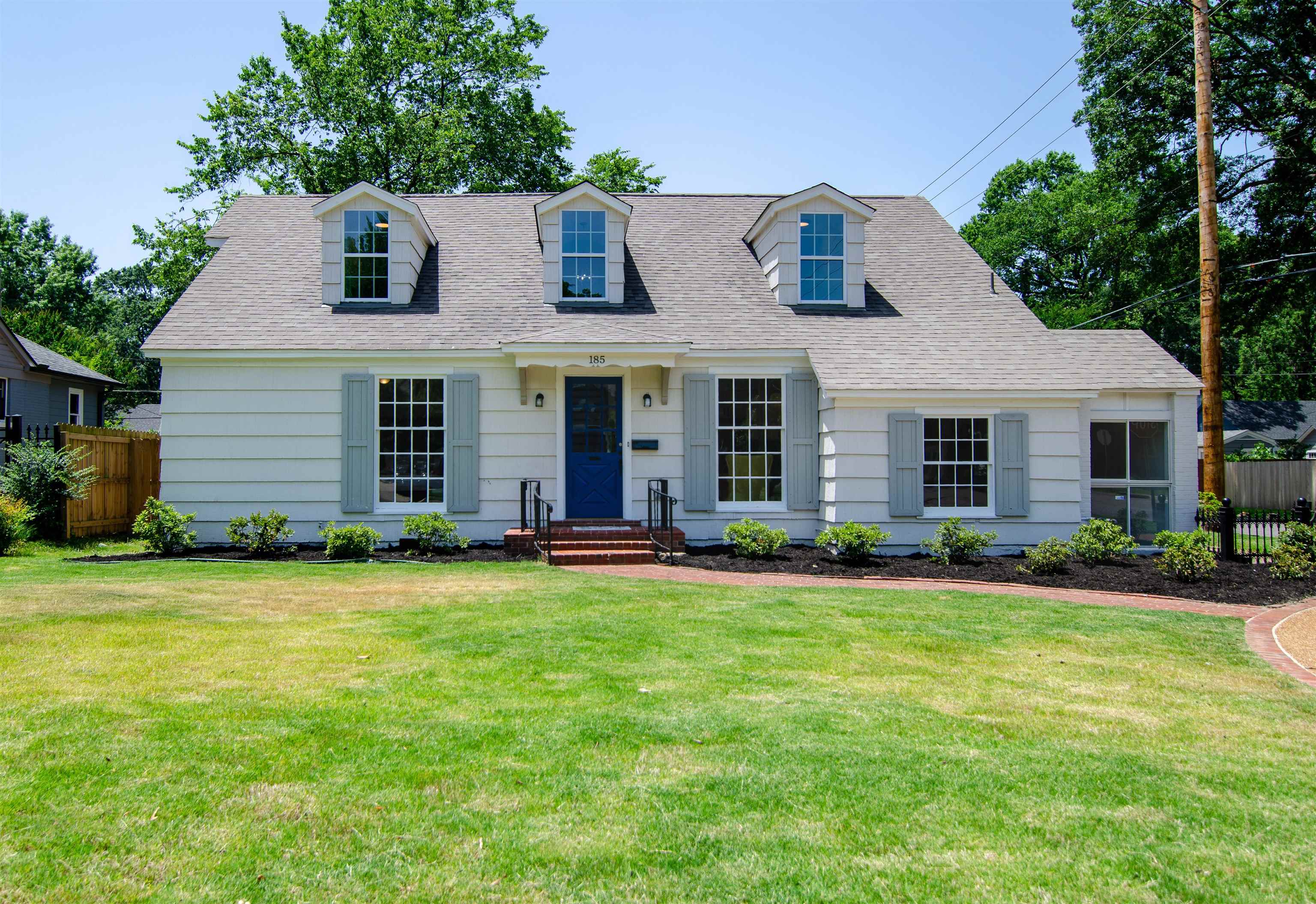 front view of a house with a yard