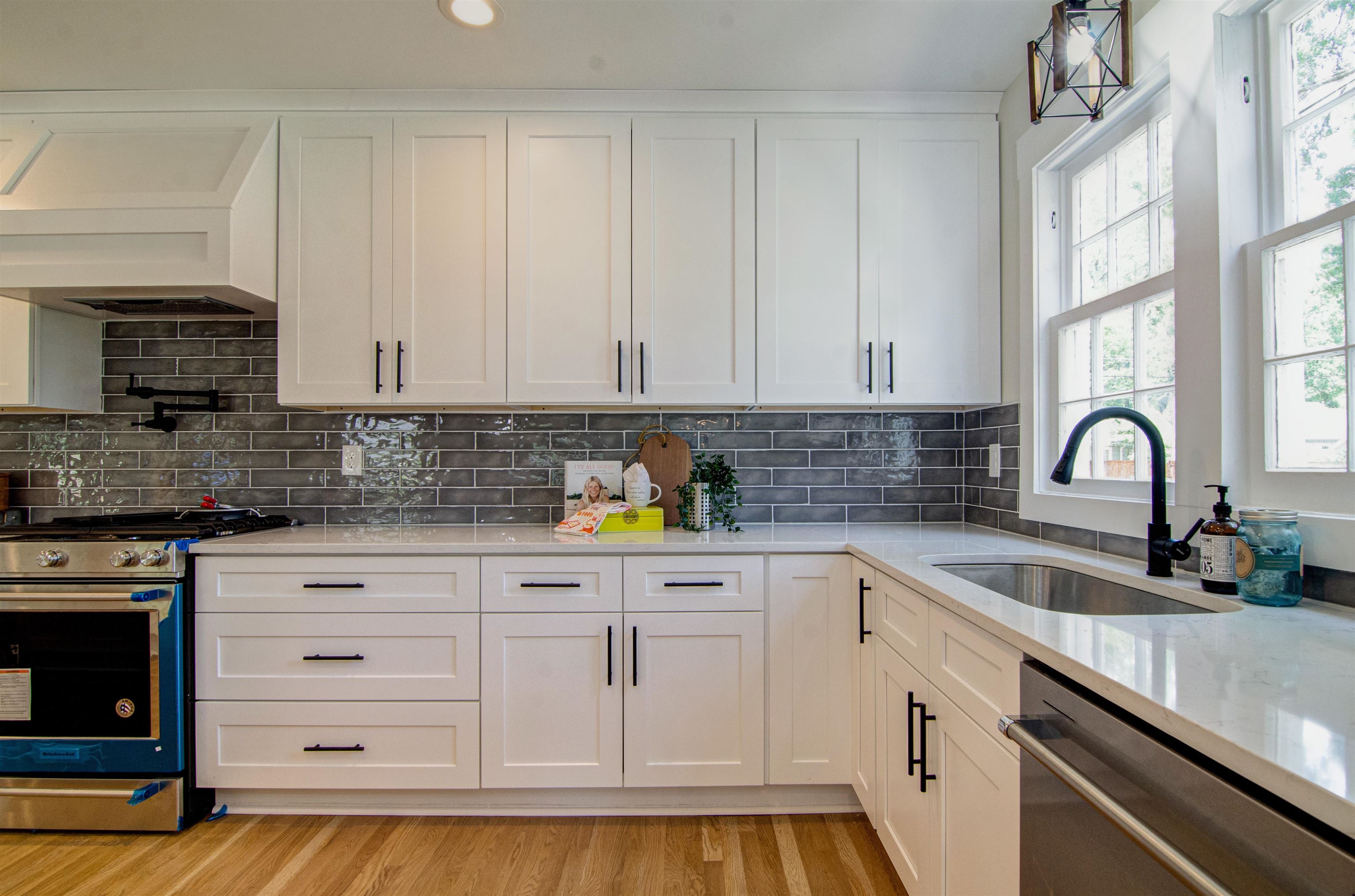 185 Alexander Street Memphis, TN 38111 - Photo 11 of 25 a kitchen with white cabinets and appliances