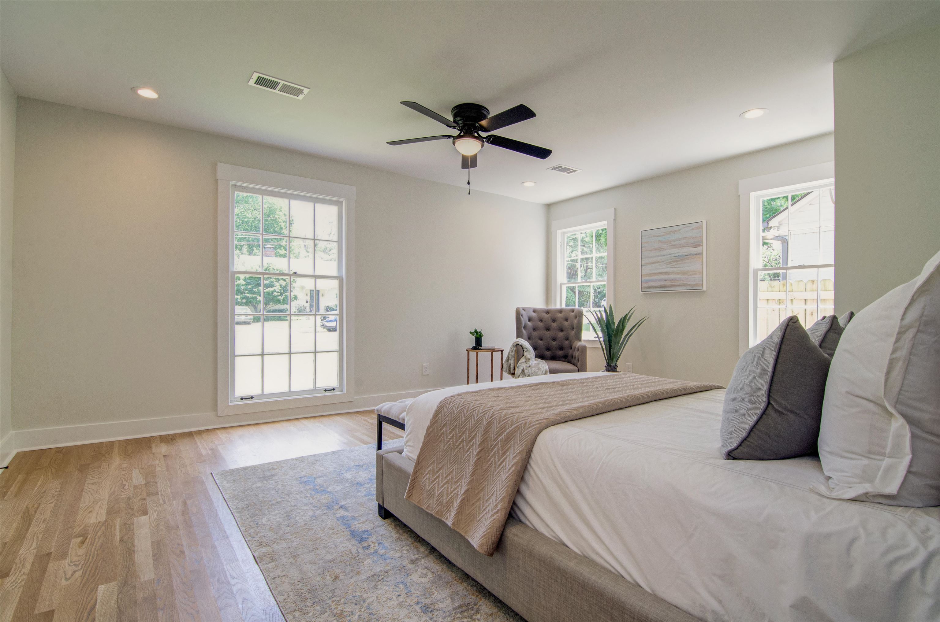 185 Alexander Street Memphis, TN 38111 - Photo 15 of 25 a spacious bedroom with a bed a dresser and a window