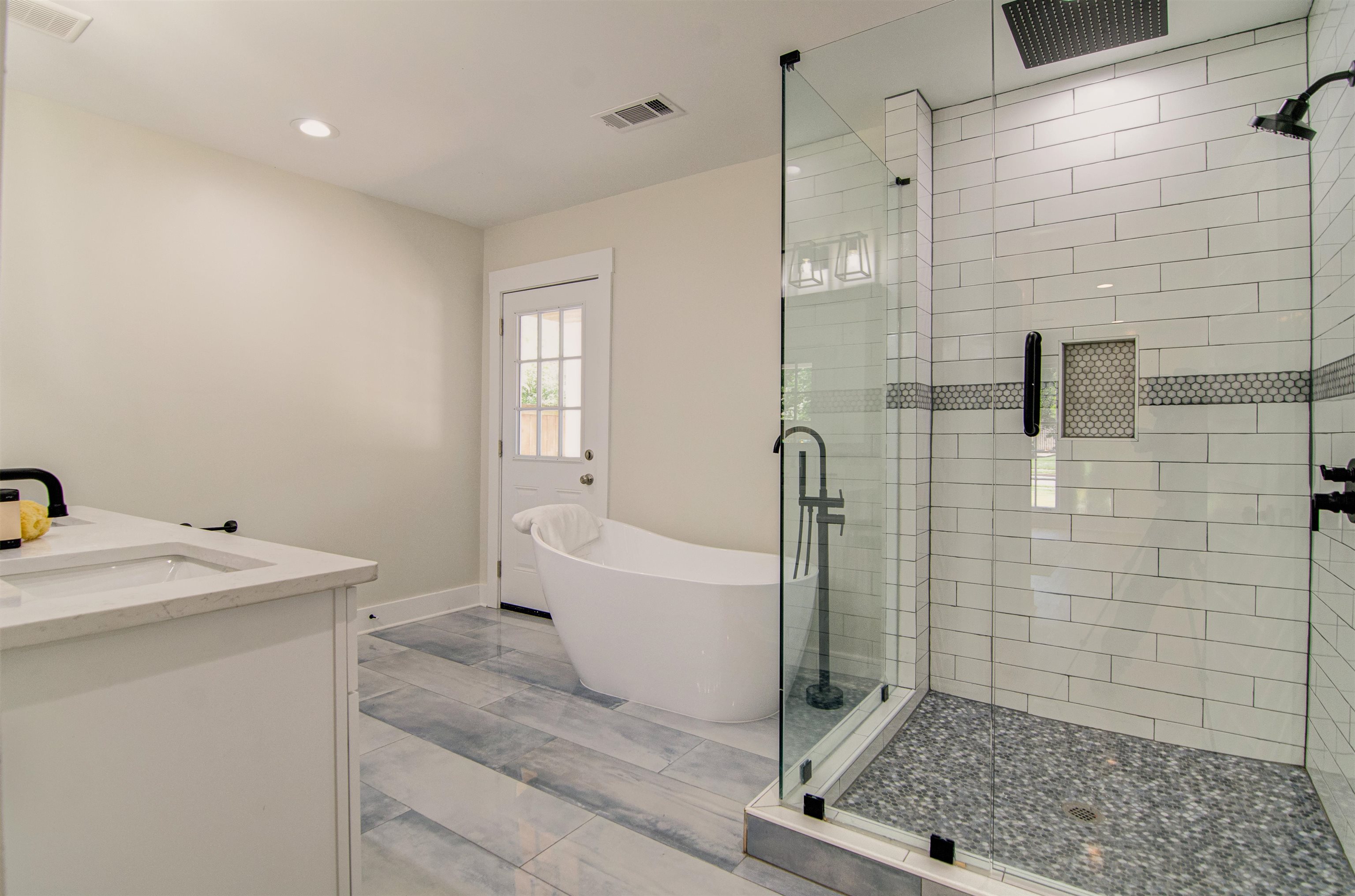 185 Alexander Street Memphis, TN 38111 - Photo 16 of 25 a bathroom with a sink a toilet and shower