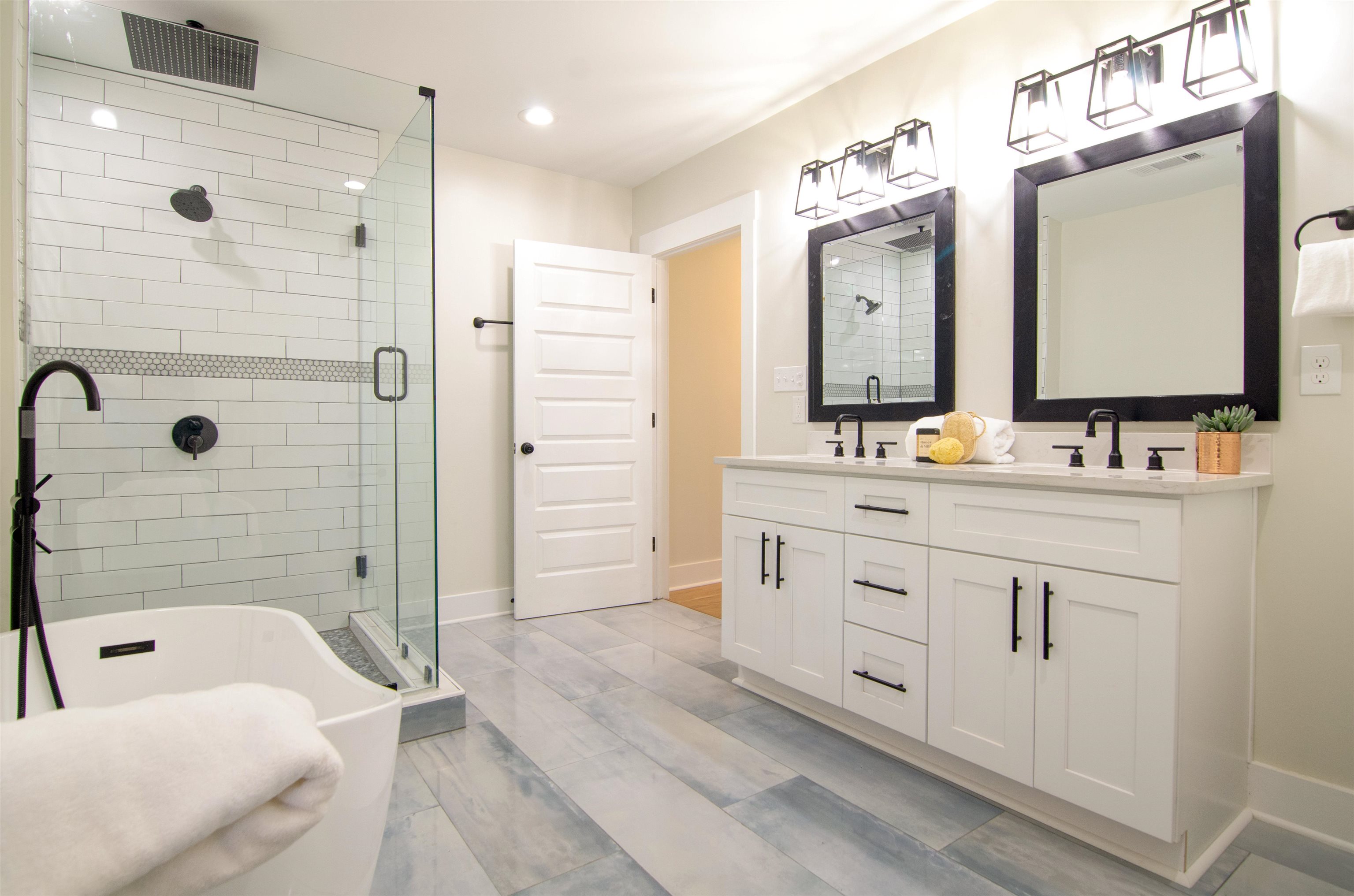 185 Alexander Street Memphis, TN 38111 - Photo 17 of 25 a bathroom with a double vanity sink mirror double and shower