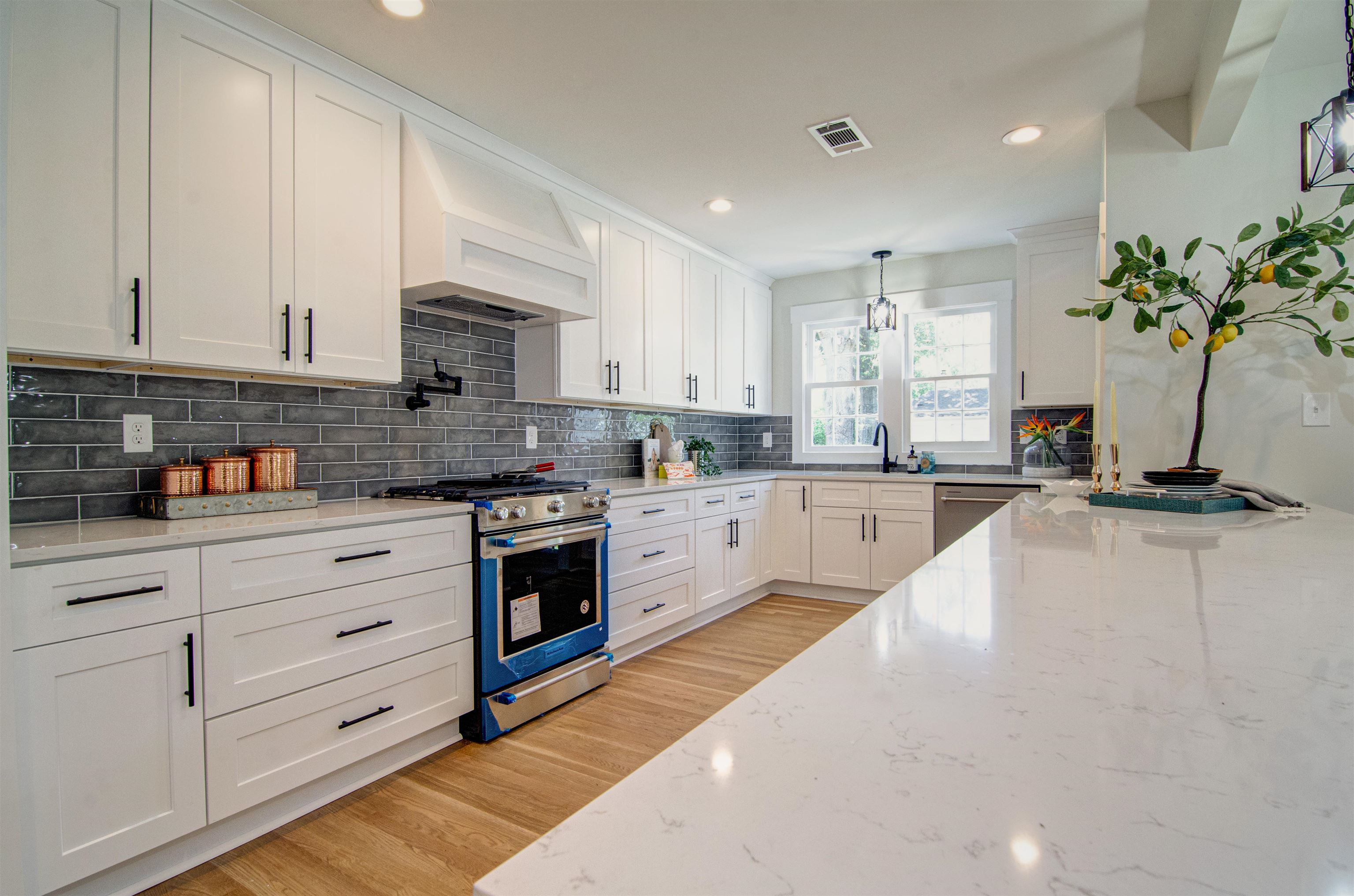 185 Alexander Street Memphis, TN 38111 - Photo 7 of 25 a kitchen with kitchen island granite countertop a sink stainless steel appliances and cabinets