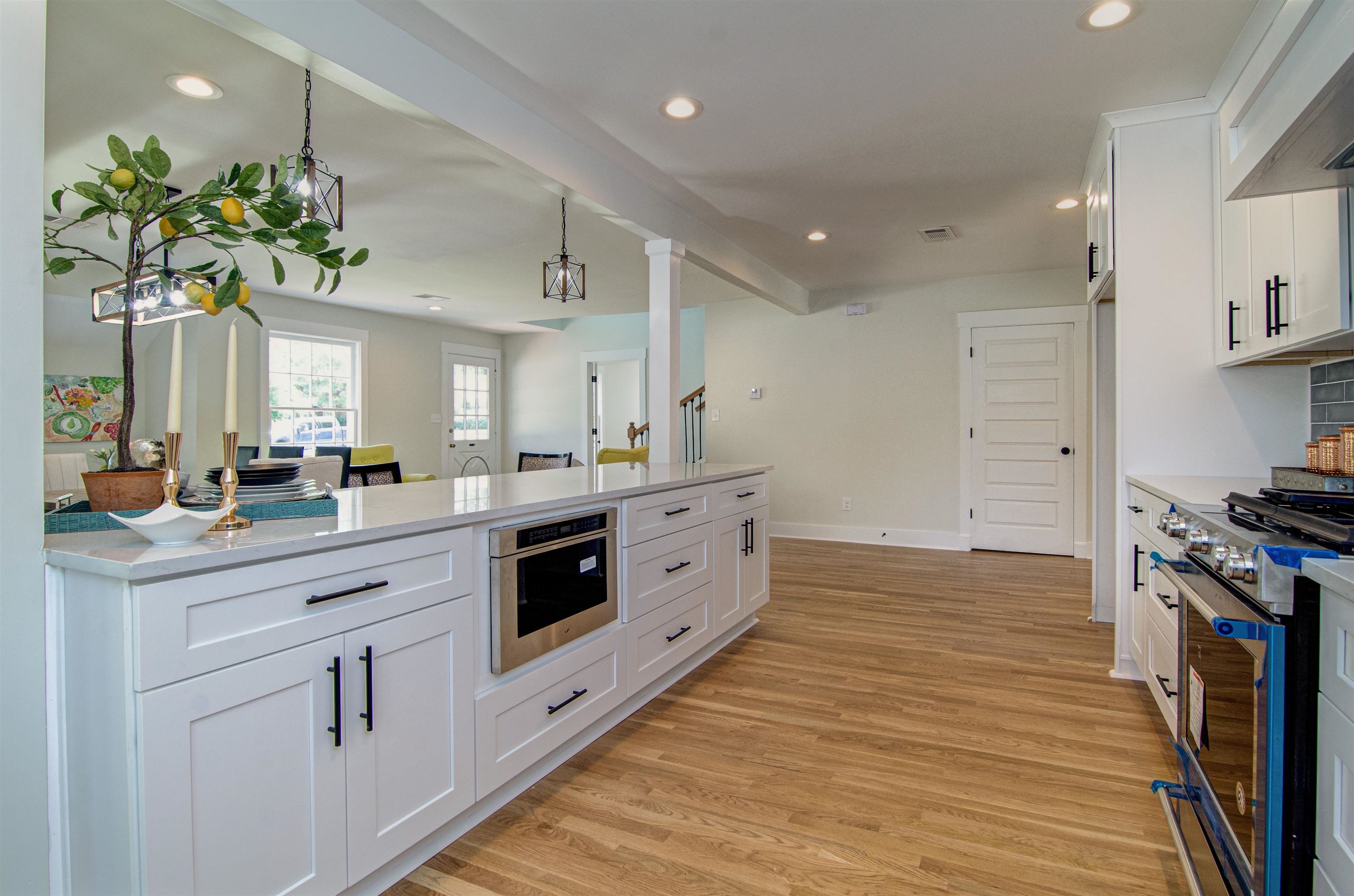 185 Alexander Street Memphis, TN 38111 - Photo 9 of 25 a kitchen with stainless steel appliances kitchen island granite countertop a stove a sink and a refrigerator