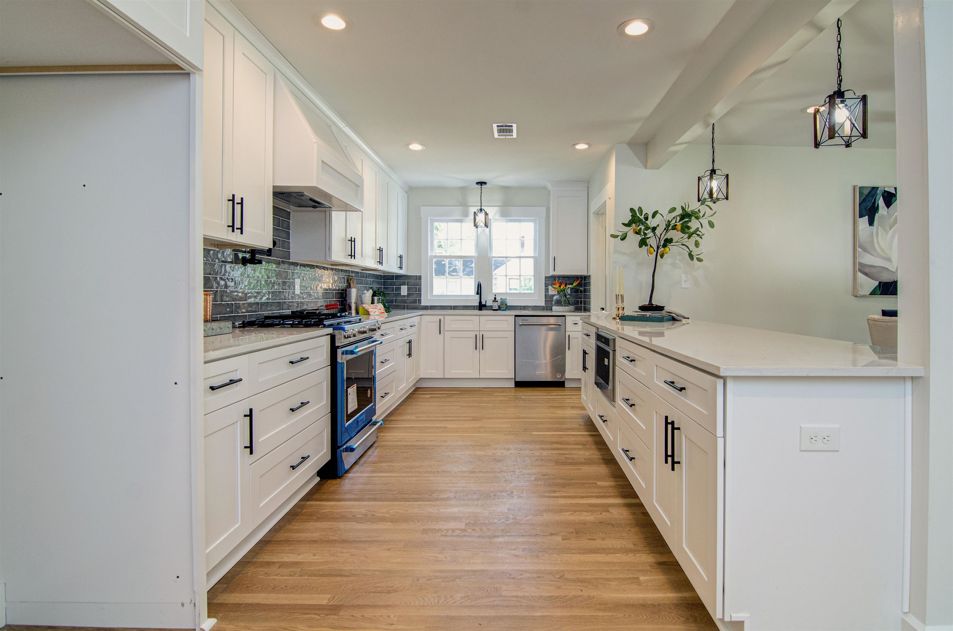 185 Alexander Street Memphis, TN 38111 - Photo 10 of 25 a large kitchen with stainless steel appliances kitchen island granite countertop a sink and cabinets