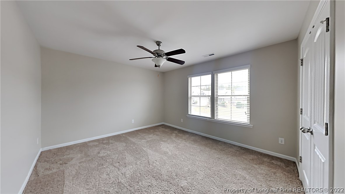 271 River Oak Street Spring Lake, NC 28390 - Photo 13 of 18 a view of a livingroom with a ceiling fan and window