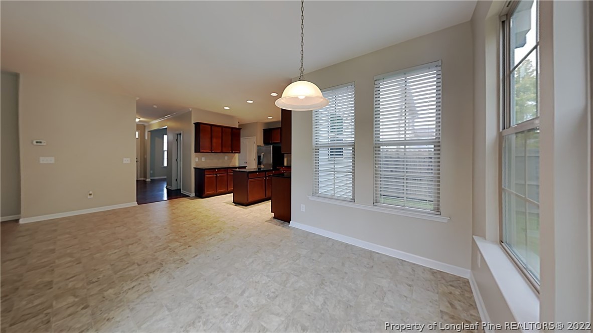 271 River Oak Street Spring Lake, NC 28390 - Photo 7 of 18 a view of a livingroom with a chandelier fan and windows