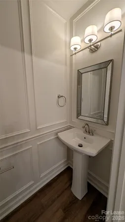 a bathroom with a toilet and a vanity