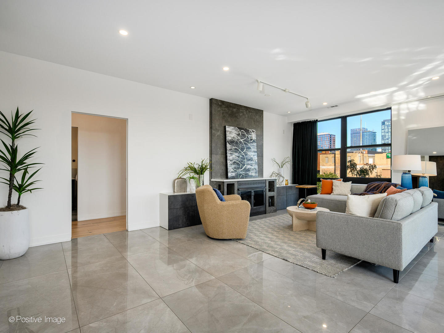 1260 West Washington Boulevard, Unit 404 Chicago, IL 60607 - Photo 12 of 26 a living room with furniture and a potted plant