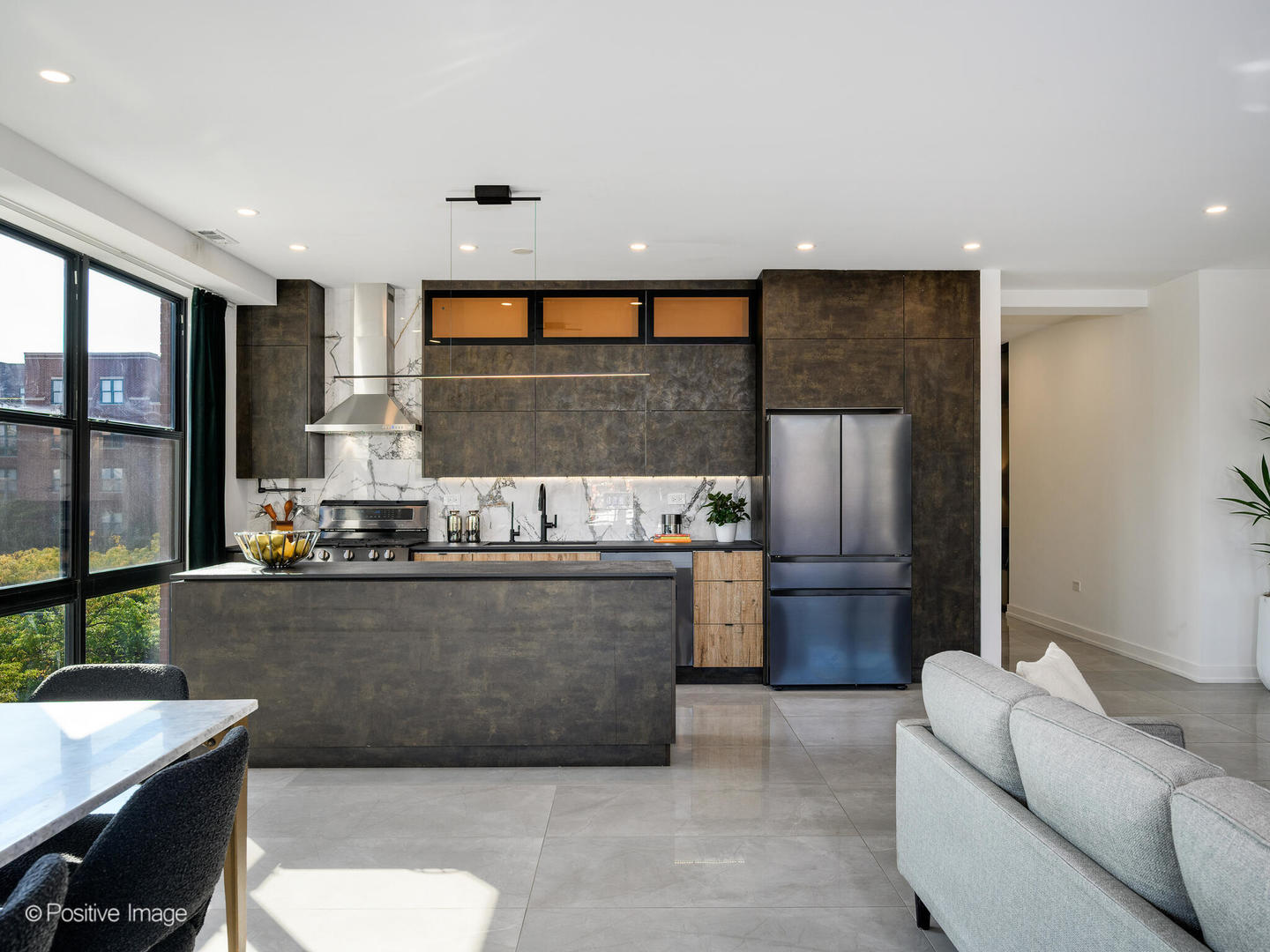 1260 West Washington Boulevard, Unit 404 Chicago, IL 60607 - Photo 5 of 26 a living room with stainless steel appliances kitchen island granite countertop furniture and a large window