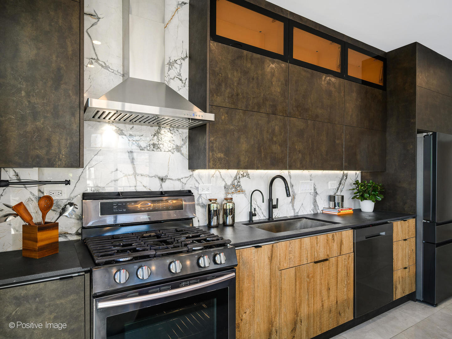 1260 West Washington Boulevard, Unit 404 Chicago, IL 60607 - Photo 10 of 26 a kitchen with stainless steel appliances a stove and white cabinets