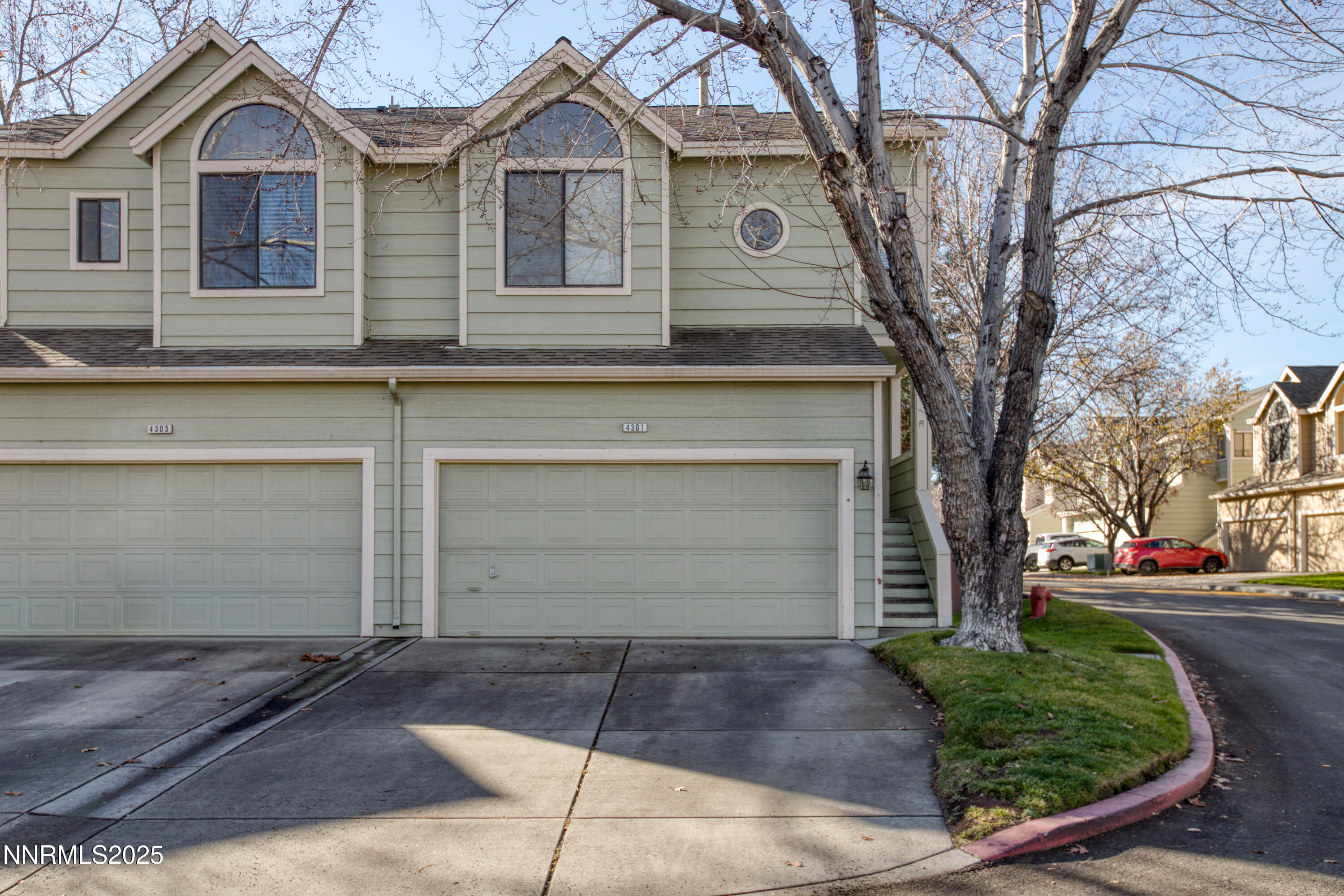 4301 Loreto Lane Reno, NV 89502 - Photo 1 of 36 a front view of a house with a yard and garage