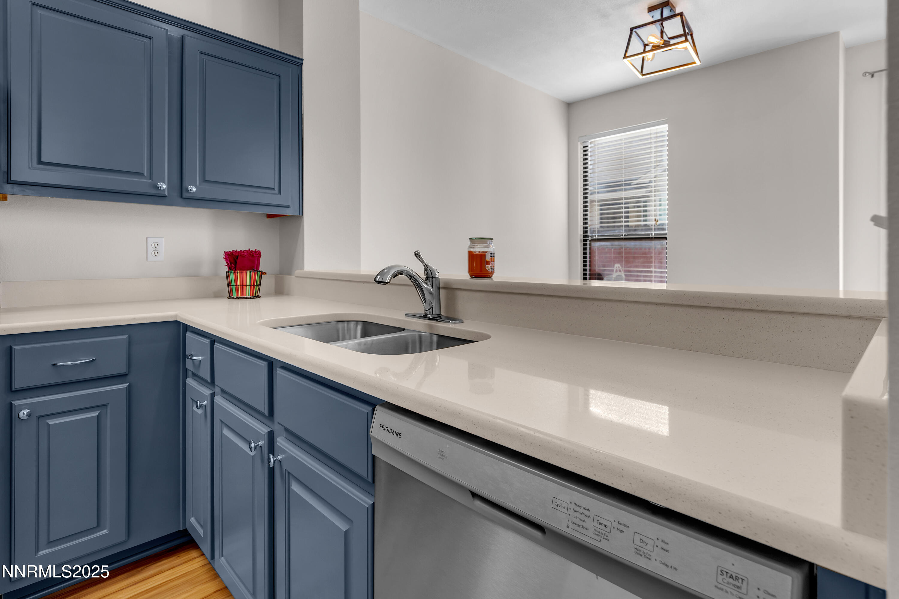 4301 Loreto Lane Reno, NV 89502 - Photo 12 of 36 a kitchen with a sink cabinets and a window