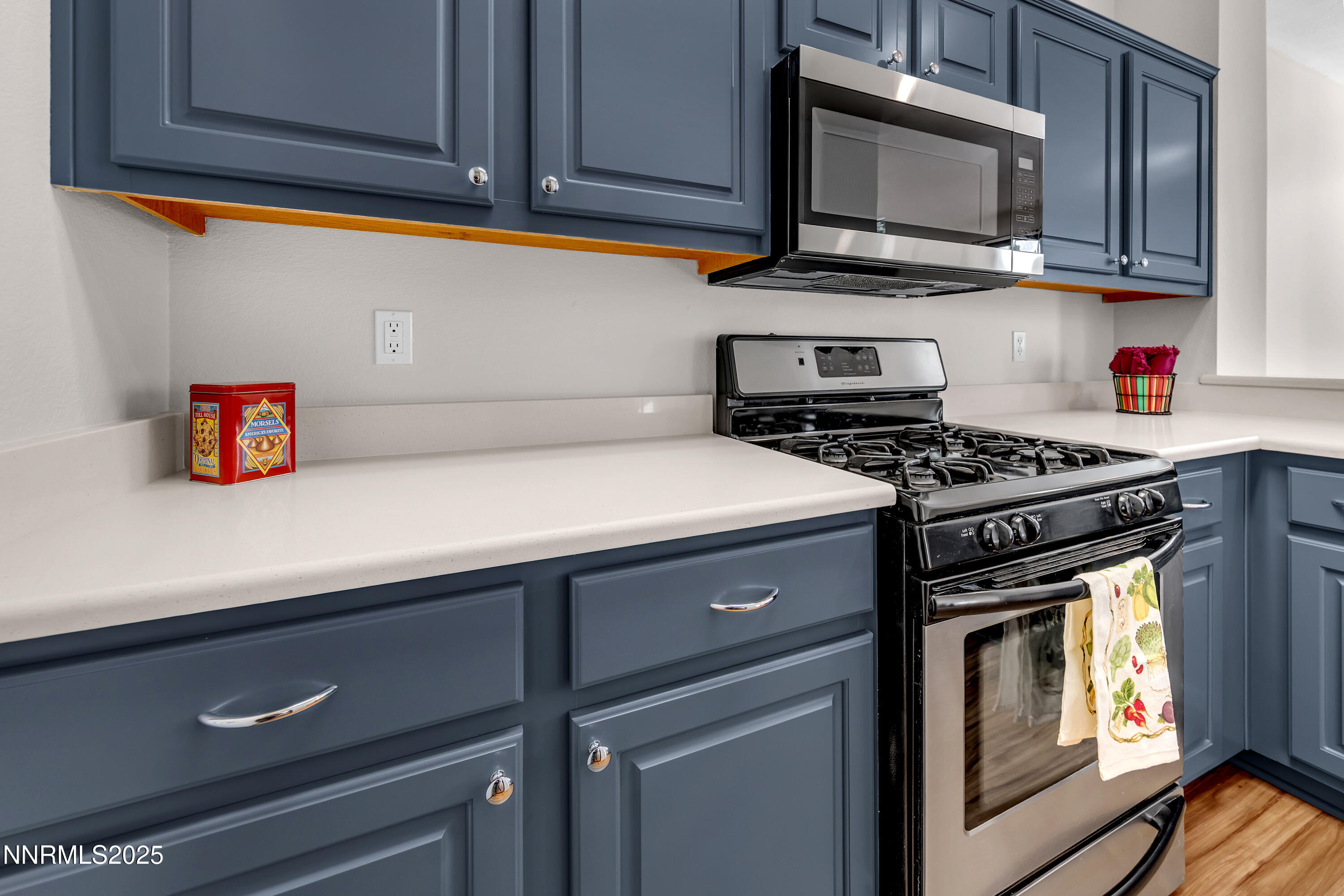4301 Loreto Lane Reno, NV 89502 - Photo 14 of 36 a kitchen with stainless steel appliances a stove and a microwave