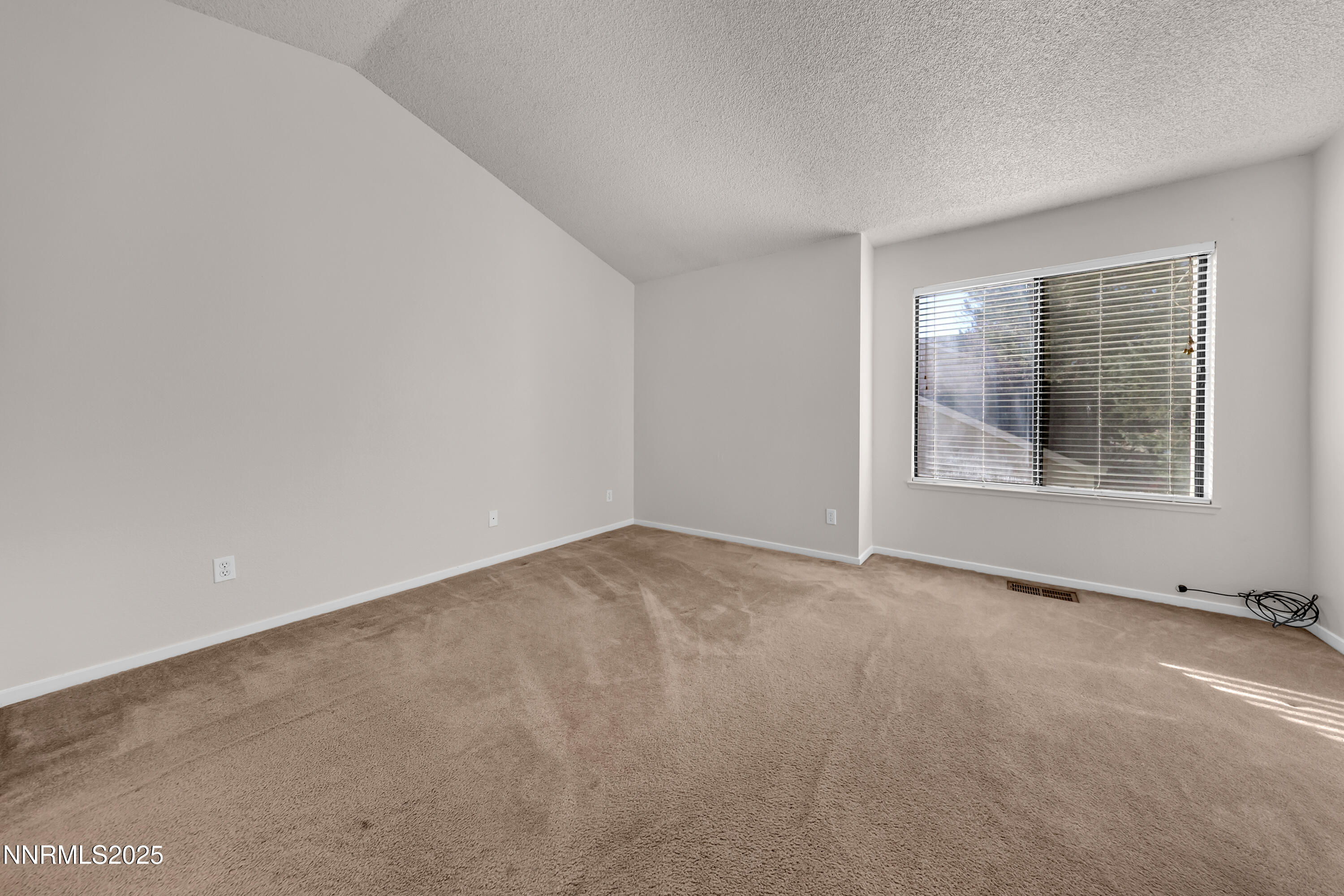 4301 Loreto Lane Reno, NV 89502 - Photo 17 of 36 an empty room with a window