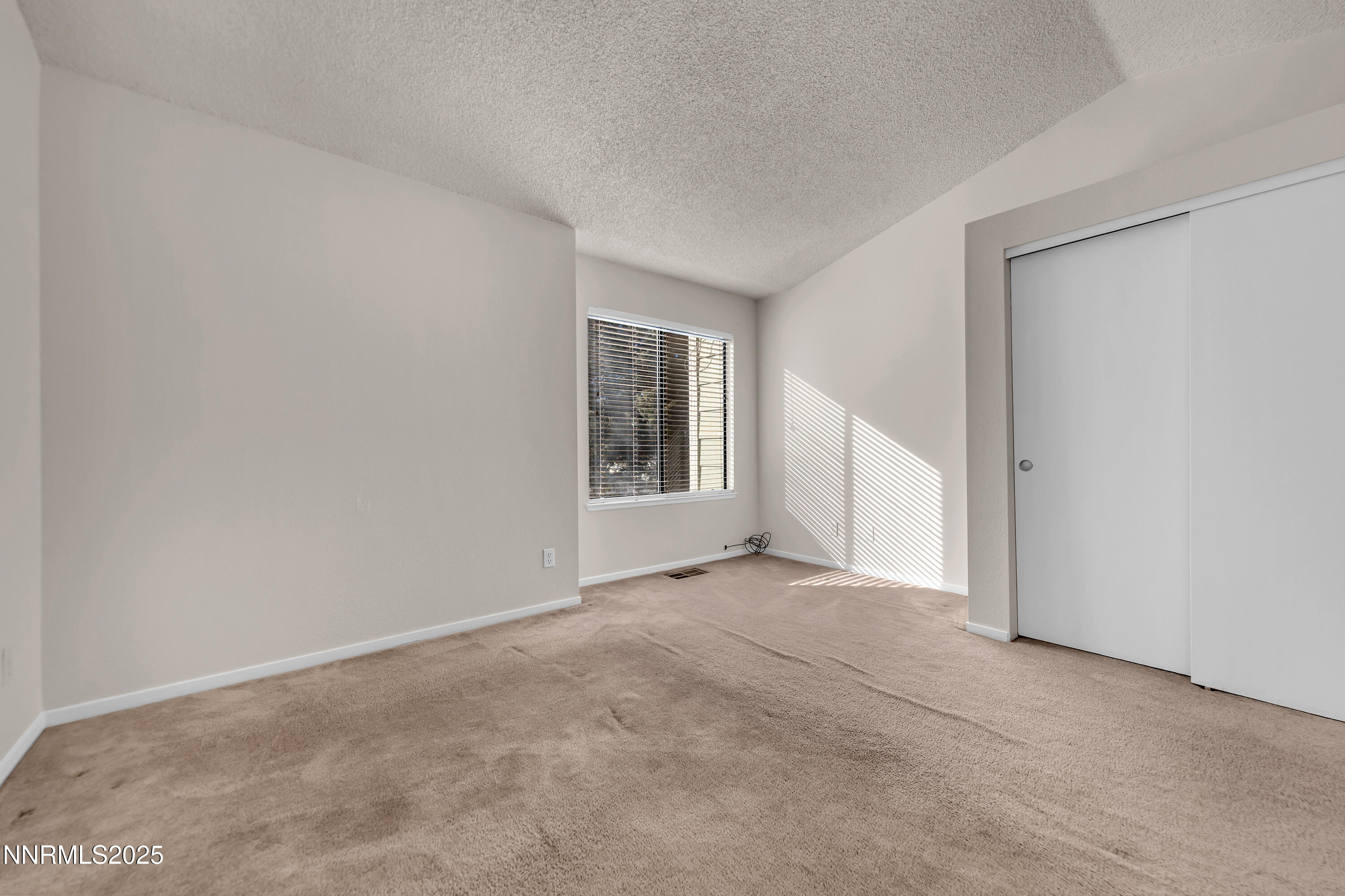 4301 Loreto Lane Reno, NV 89502 - Photo 19 of 36 a view of an empty room with a window