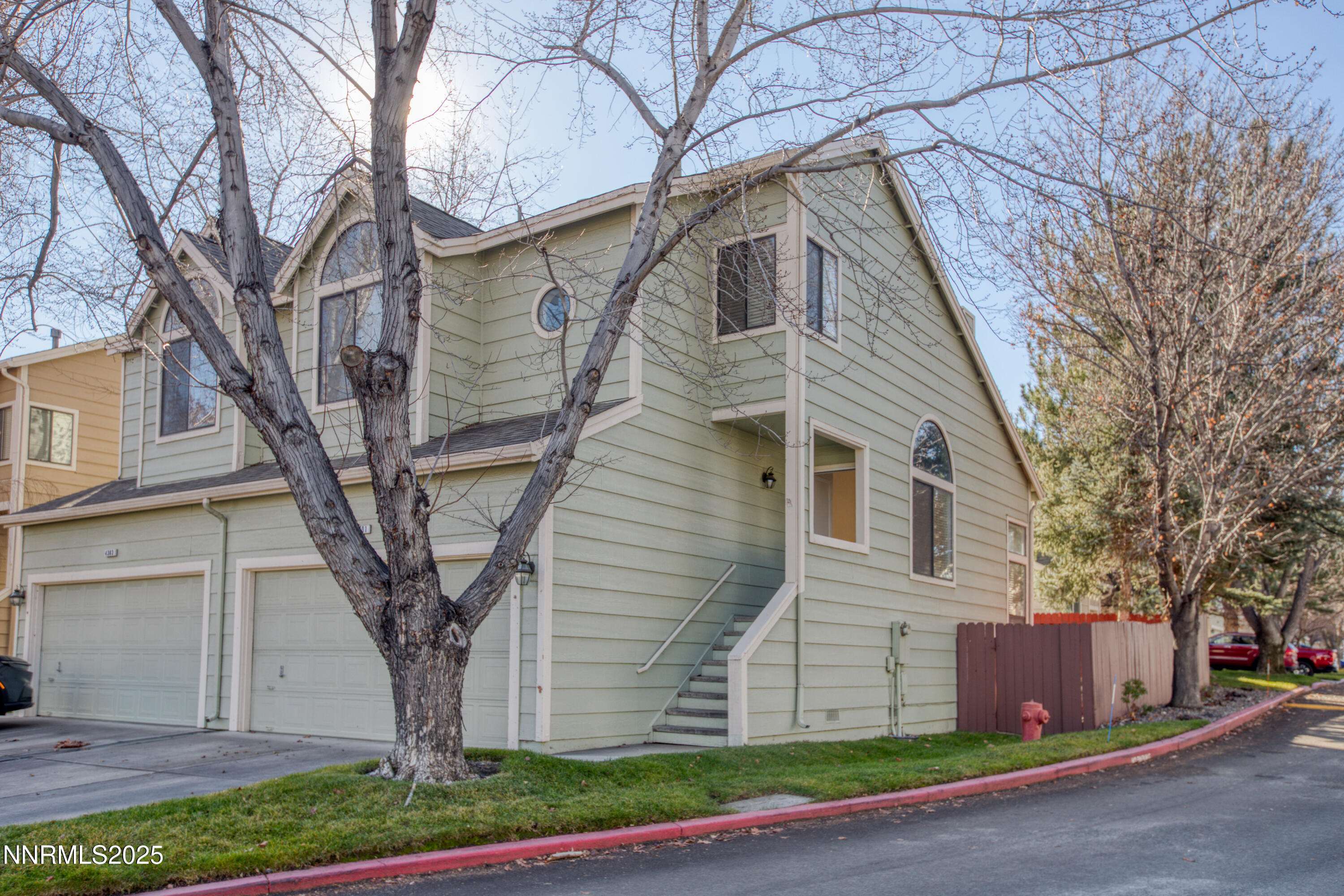 4301 Loreto Lane Reno, NV 89502 - Photo 2 of 36 a front view of a house with a yard and garage