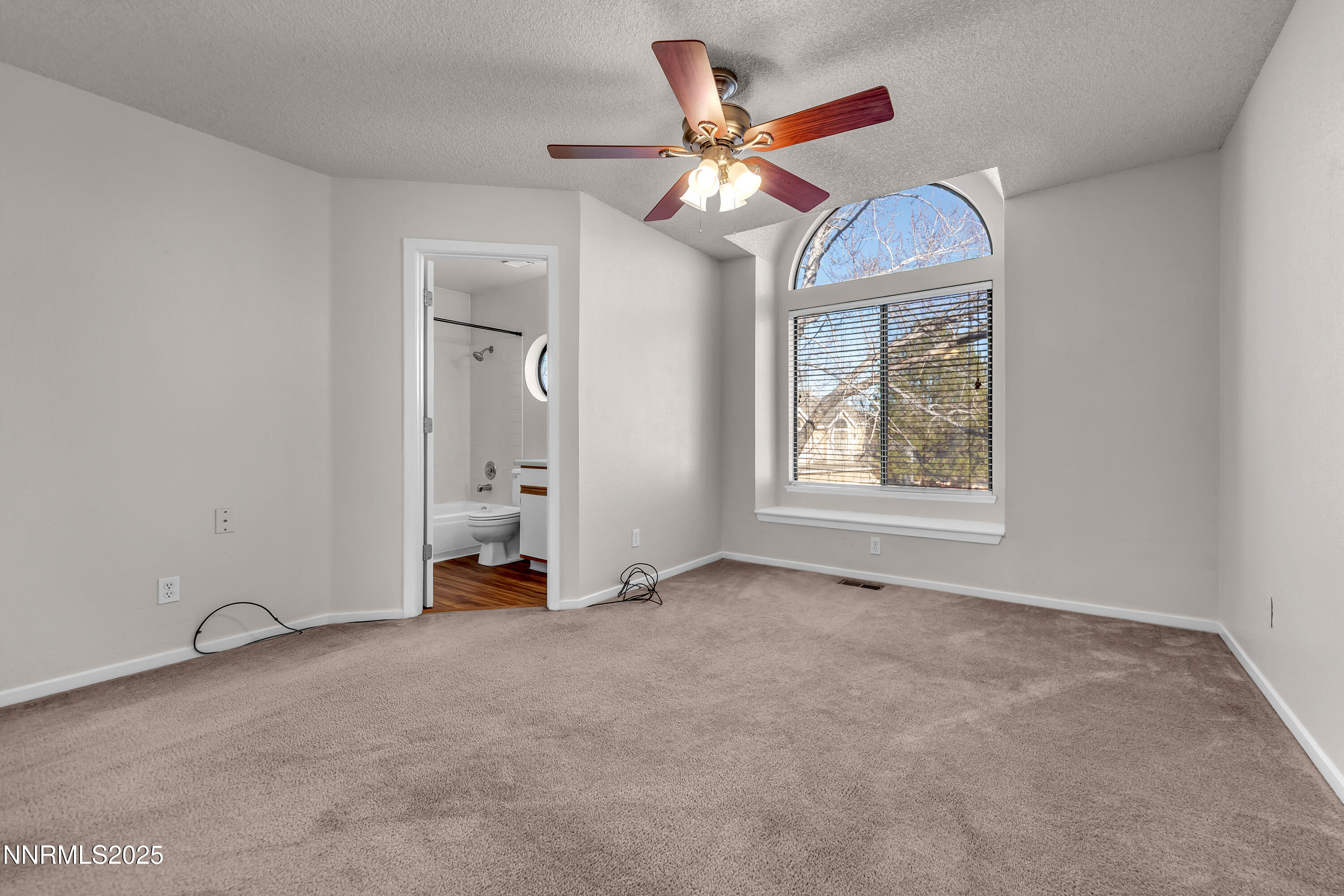 4301 Loreto Lane Reno, NV 89502 - Photo 24 of 36 an empty room with windows and fan