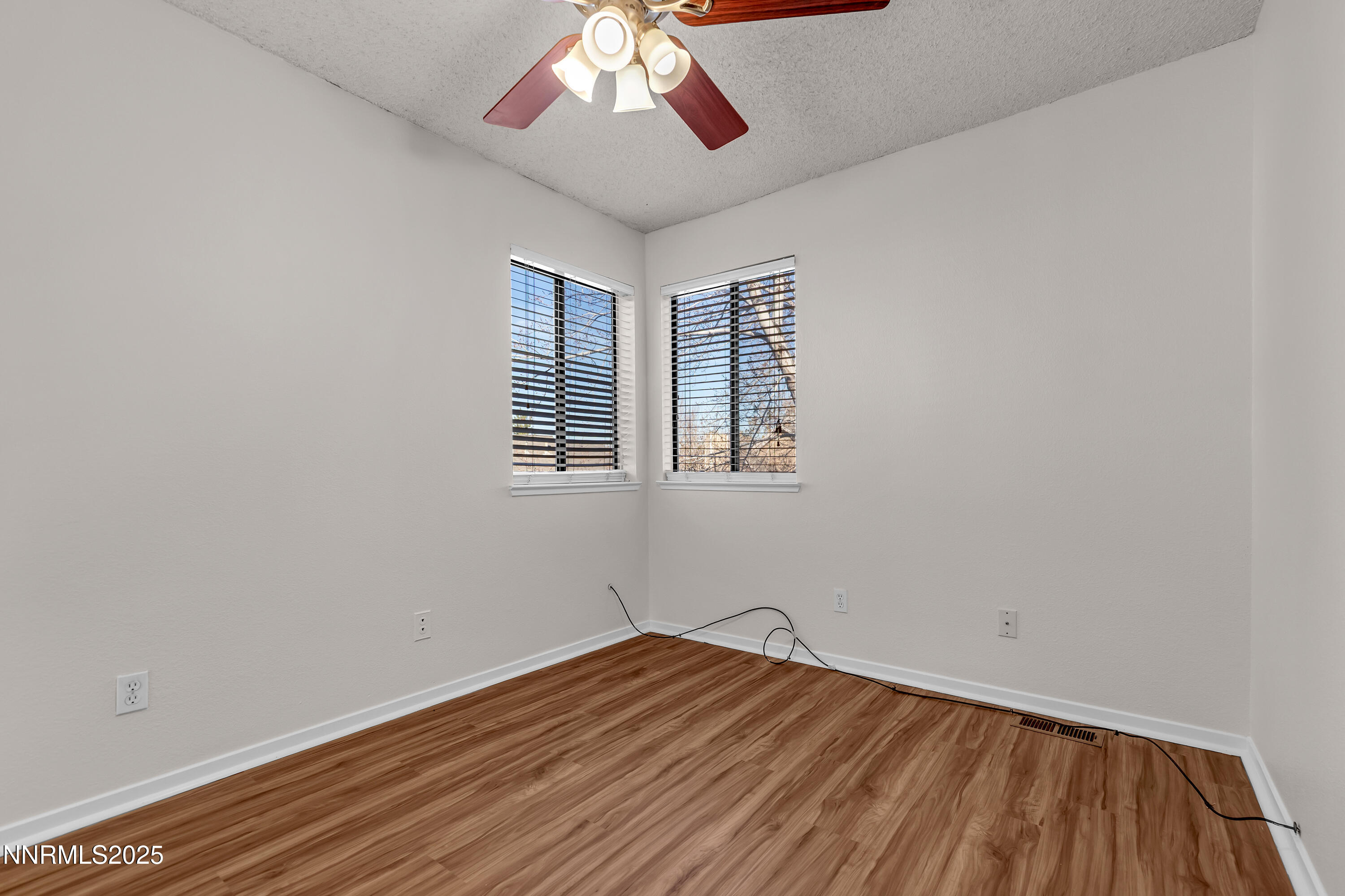 4301 Loreto Lane Reno, NV 89502 - Photo 28 of 36 wooden floor in an empty room with a window