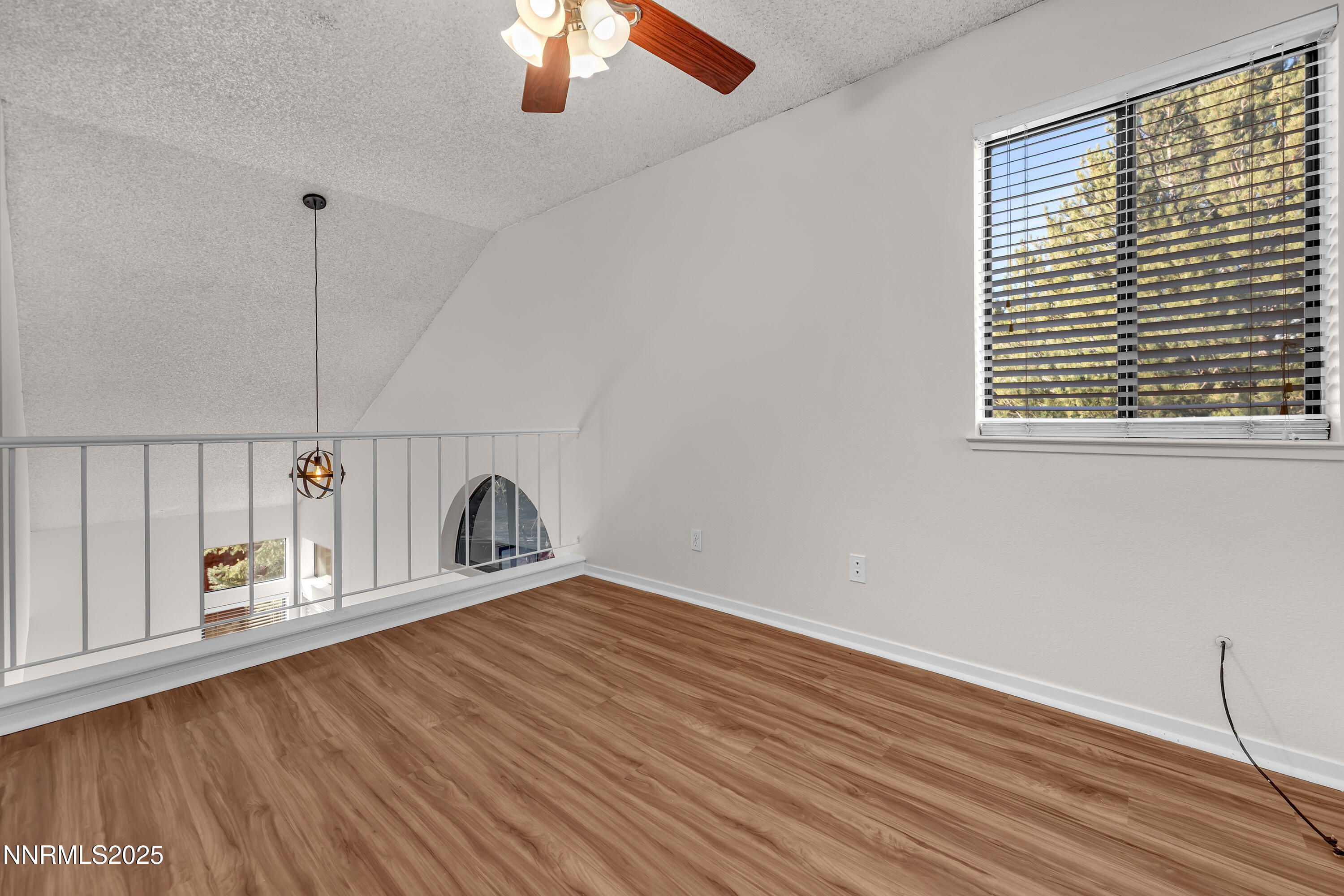 4301 Loreto Lane Reno, NV 89502 - Photo 30 of 36 a view of a room with wooden floor and window
