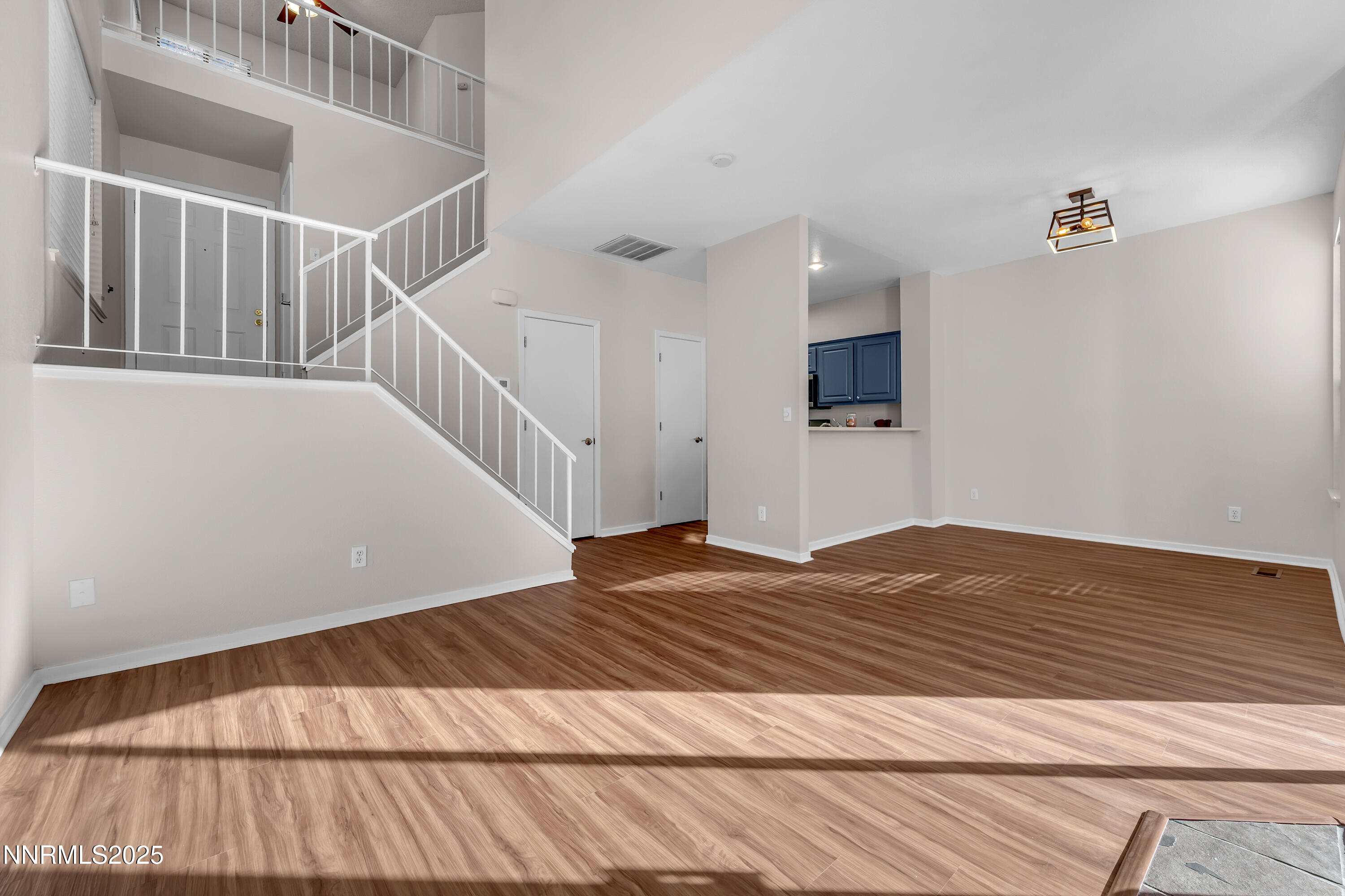 4301 Loreto Lane Reno, NV 89502 - Photo 5 of 36 a view of a room with wooden floor and stairs