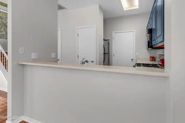 a view of an entryway with wooden floor