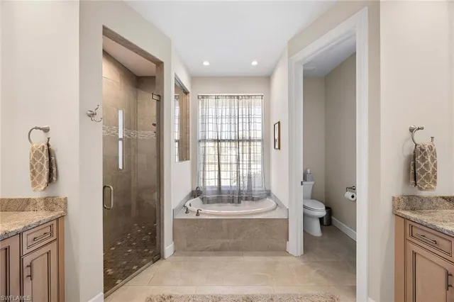a bathroom with a tub sink and toilet