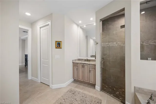 a bathroom with a shower and a sink