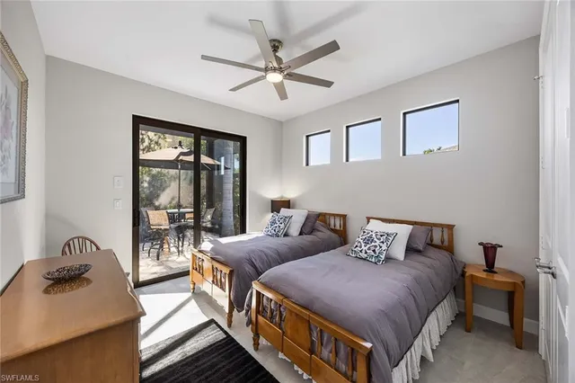 a bedroom with furniture and a window