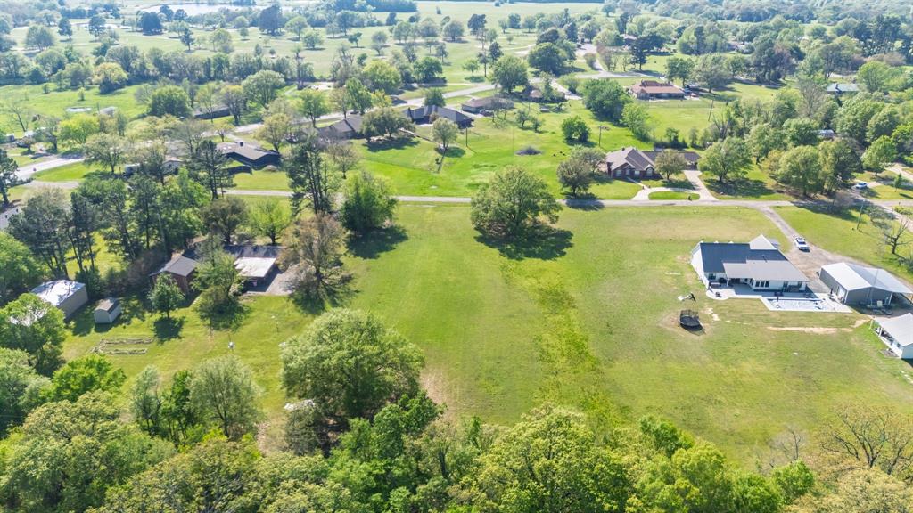Tbd McKenzie Road Campbell, TX 75422 - Photo 20 of 32 an aerial view of residential houses with outdoor space and swimming pool
