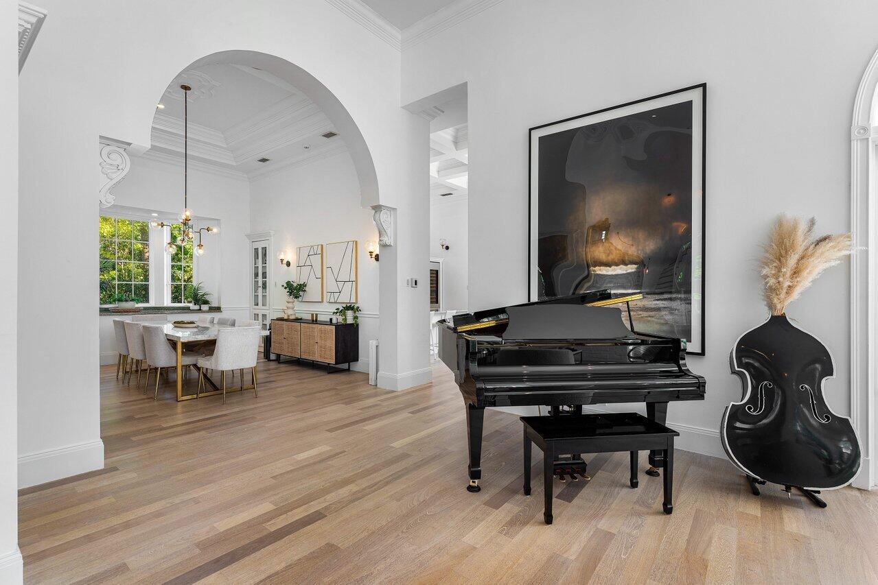 6080 Old Ocean Boulevard Ocean Ridge, FL 33435 - Photo 11 of 50 a living room with furniture a wooden floor and a piano
