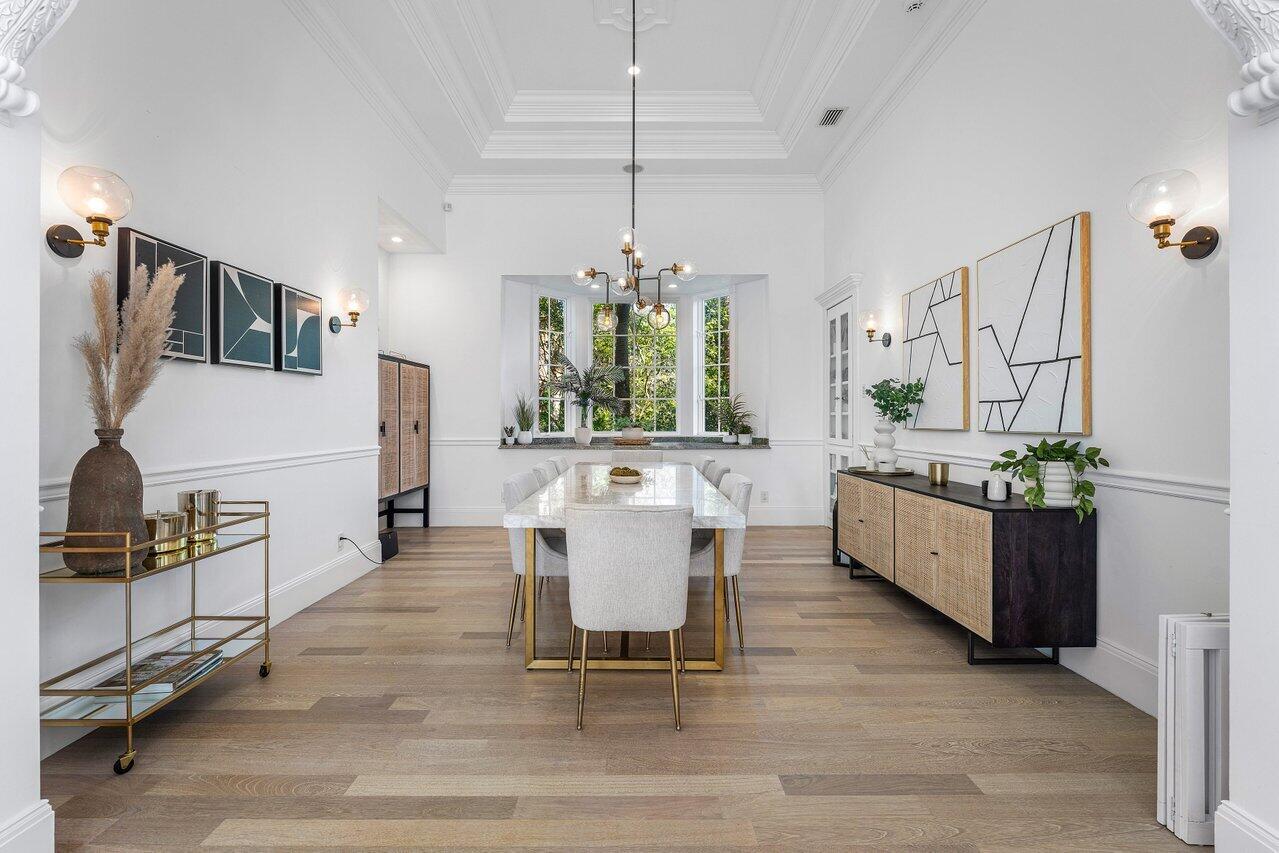 6080 Old Ocean Boulevard Ocean Ridge, FL 33435 - Photo 20 of 50 a large white kitchen with a large island in the center