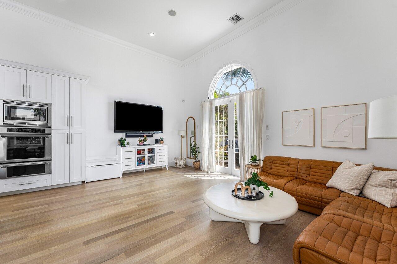 6080 Old Ocean Boulevard Ocean Ridge, FL 33435 - Photo 22 of 50 a living room with furniture and a flat screen tv