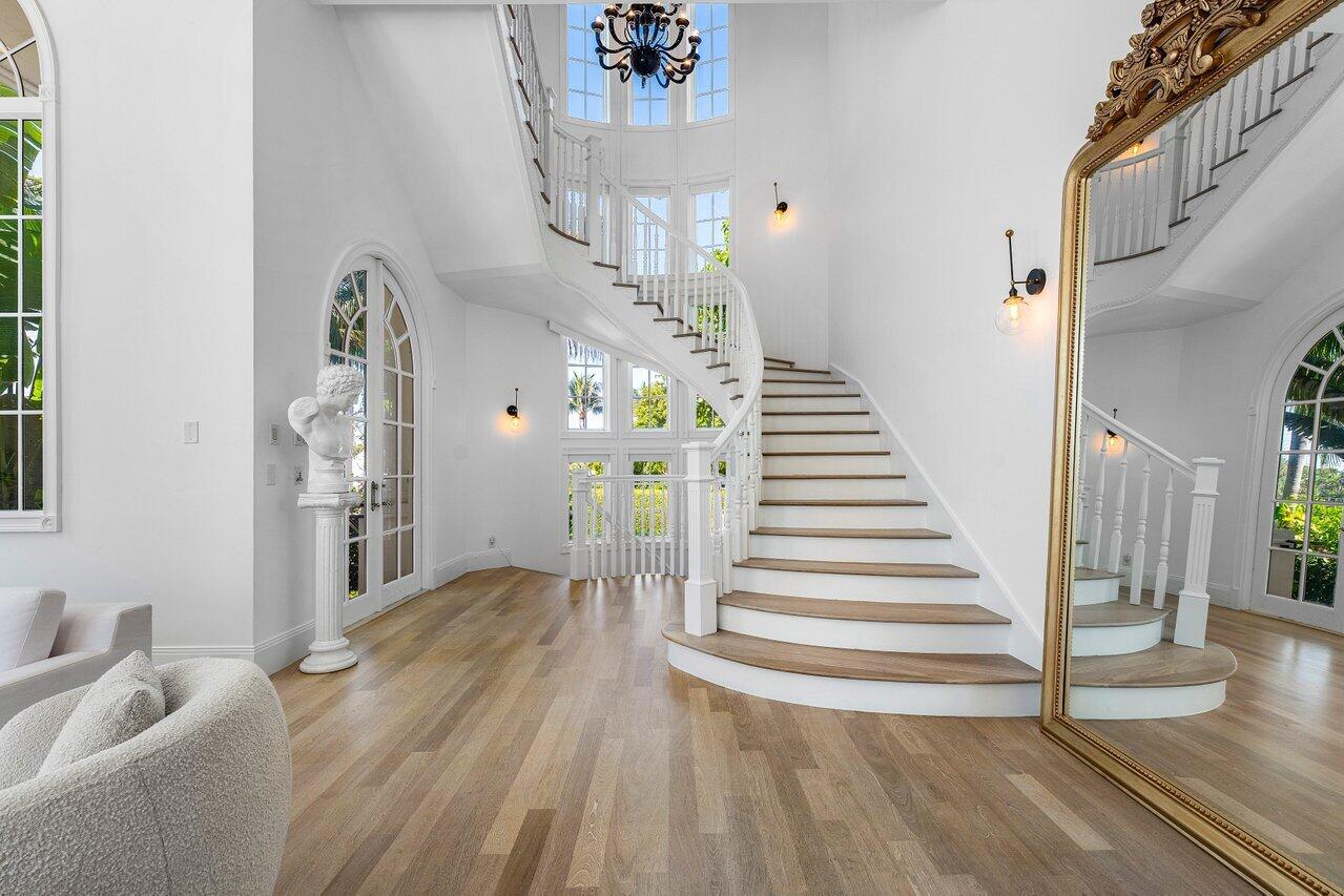 6080 Old Ocean Boulevard Ocean Ridge, FL 33435 - Photo 23 of 50 a view of a livingroom with wooden floor and stairs