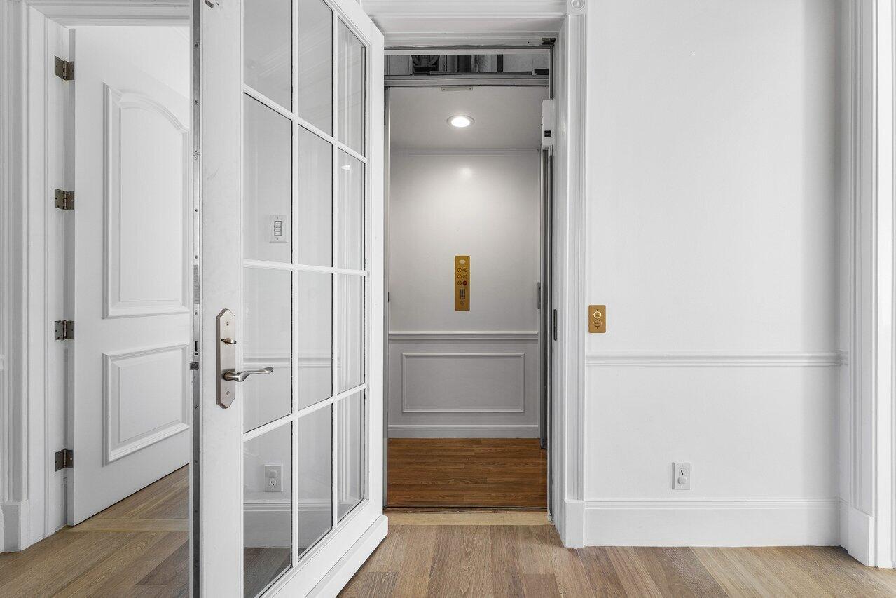 6080 Old Ocean Boulevard Ocean Ridge, FL 33435 - Photo 24 of 50 a view of walk in closet with wooden floor