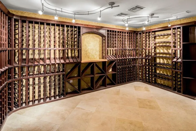 a living room with furniture a rug and a large window