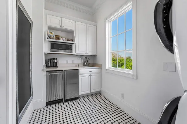 a view of a hallway with washer and dryer